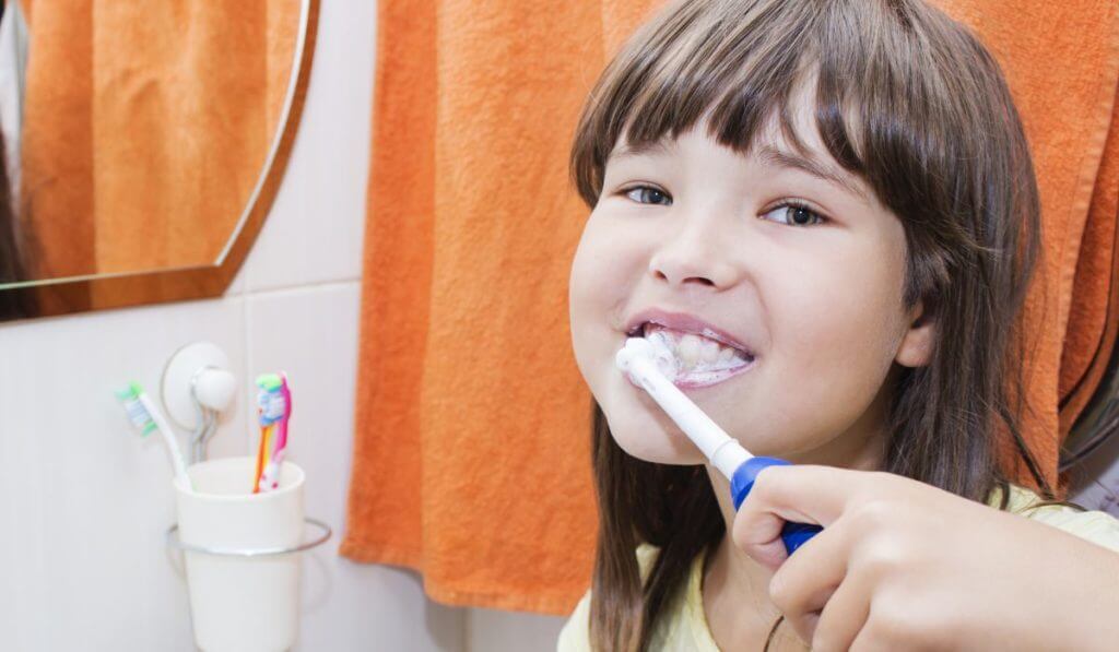child brushing teeth at pediatric dental practice centerville, ut