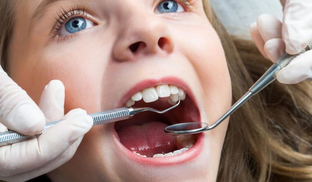 little girl at an emergency dentist